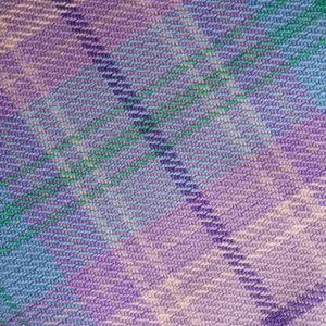 The Kinloch Anderson Picnic Rug in Romance Tartan with wax waterproof backing