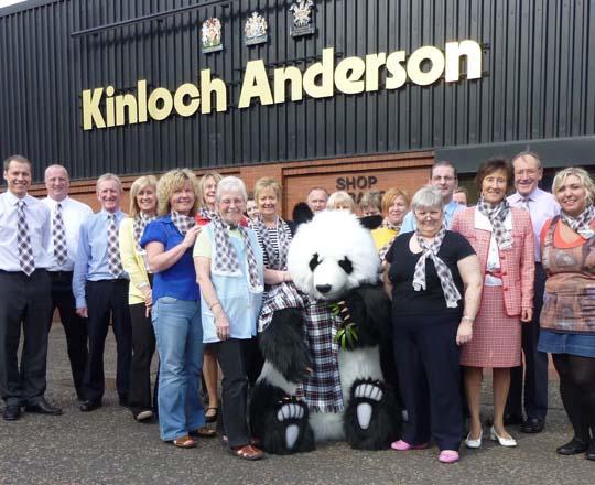 The staff at Kinloch Anderson enjoy a photoshoot with a Giant Panda!